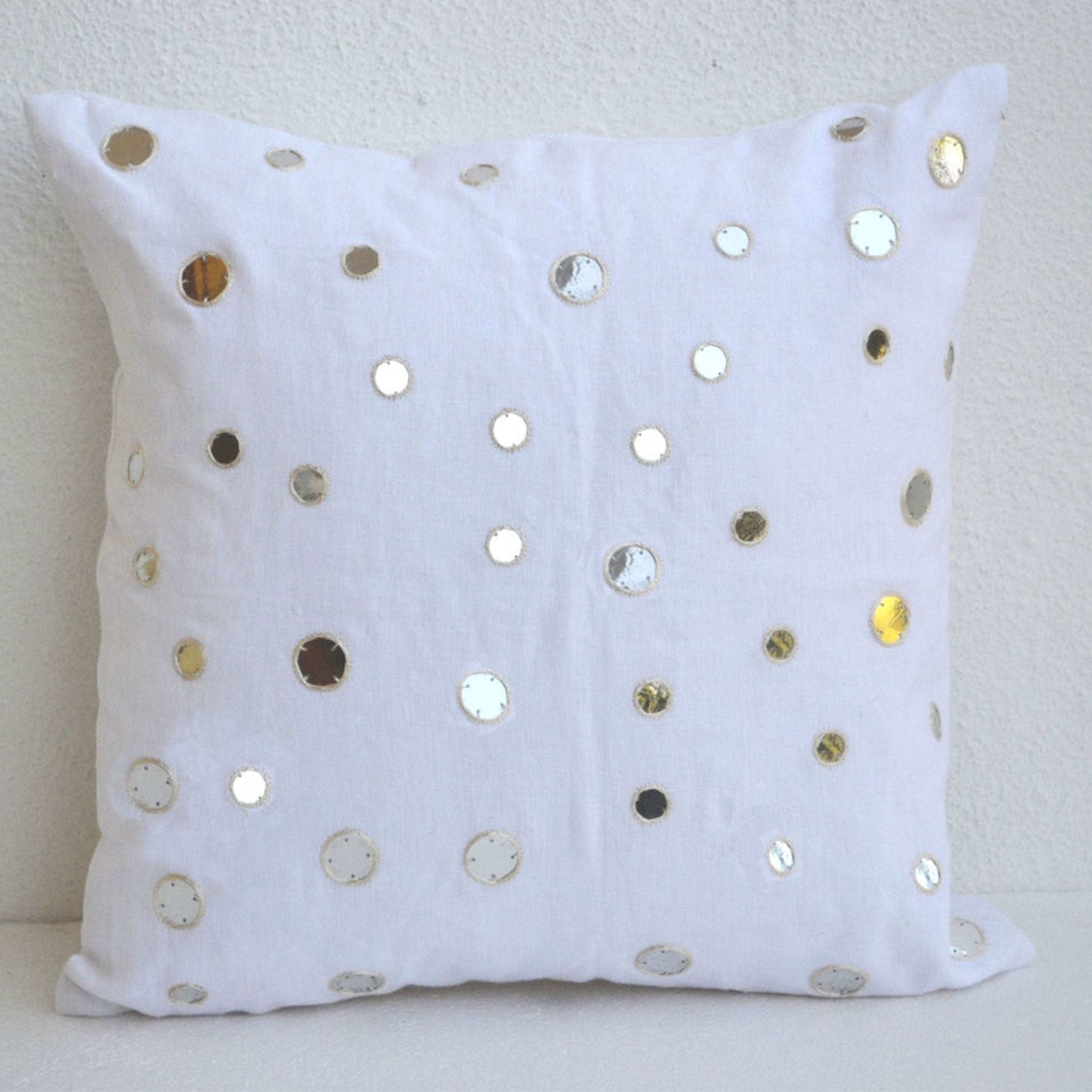 Decorative throw pillows in linen with mirrors
